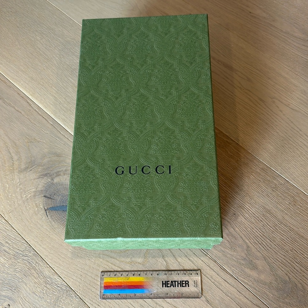 Gucci shoe box with tissue paper.